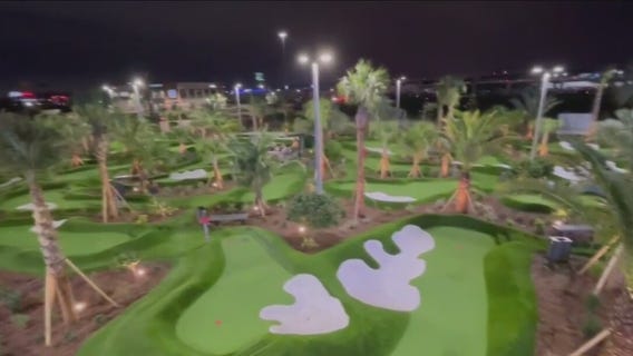 Checking out Pop Stroke, a place to eat, putt, and drink