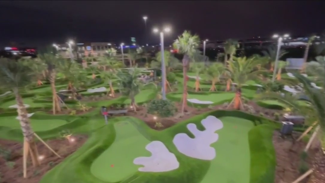 Checking out Pop Stroke, a place to eat, putt, and drink