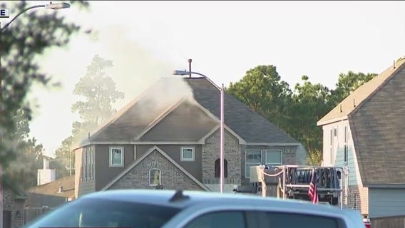 Standoff with house fire suspect in Spring