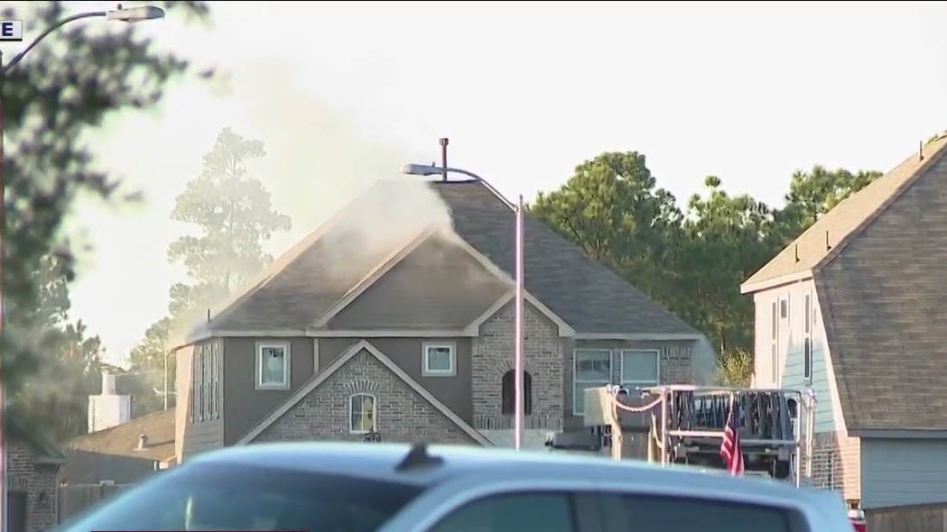 Standoff with house fire suspect in Spring