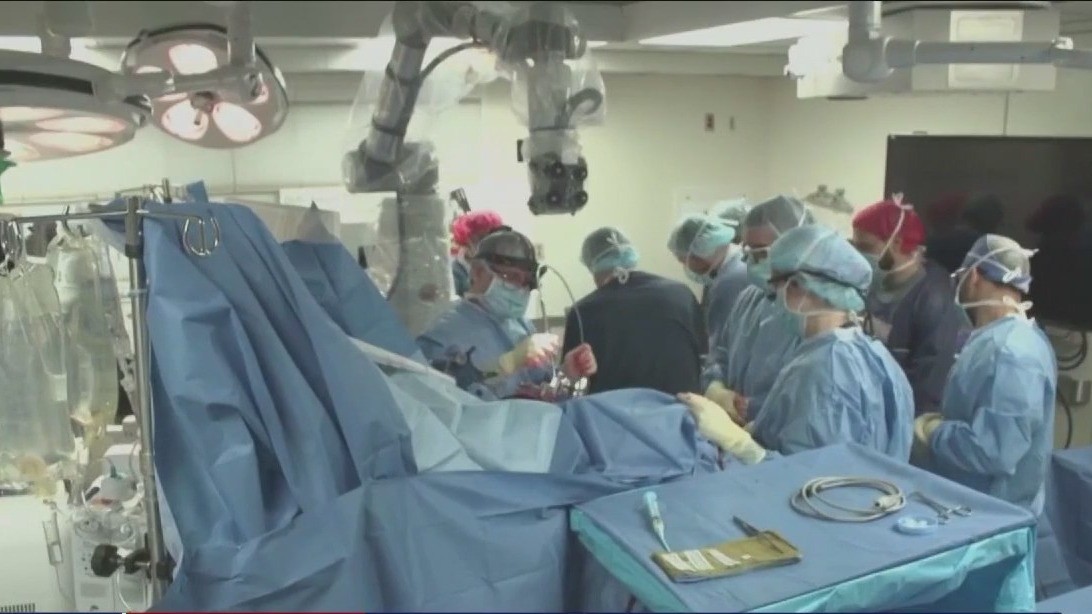 AI, brain implants help man move again