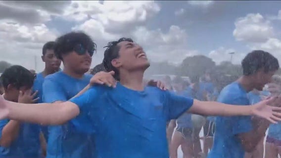 Pearland marching band doused by firetruck