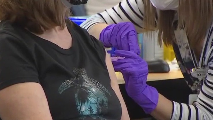 Which arm should get COVID booster shot?