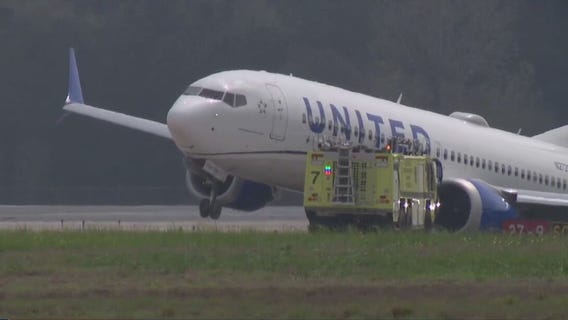 United plane skids off runway, passengers evacuate