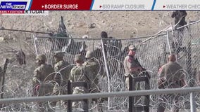 Border surge heats up, migrants rushed guardsmen