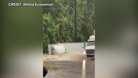 Floodwaters swallow 18-wheeler