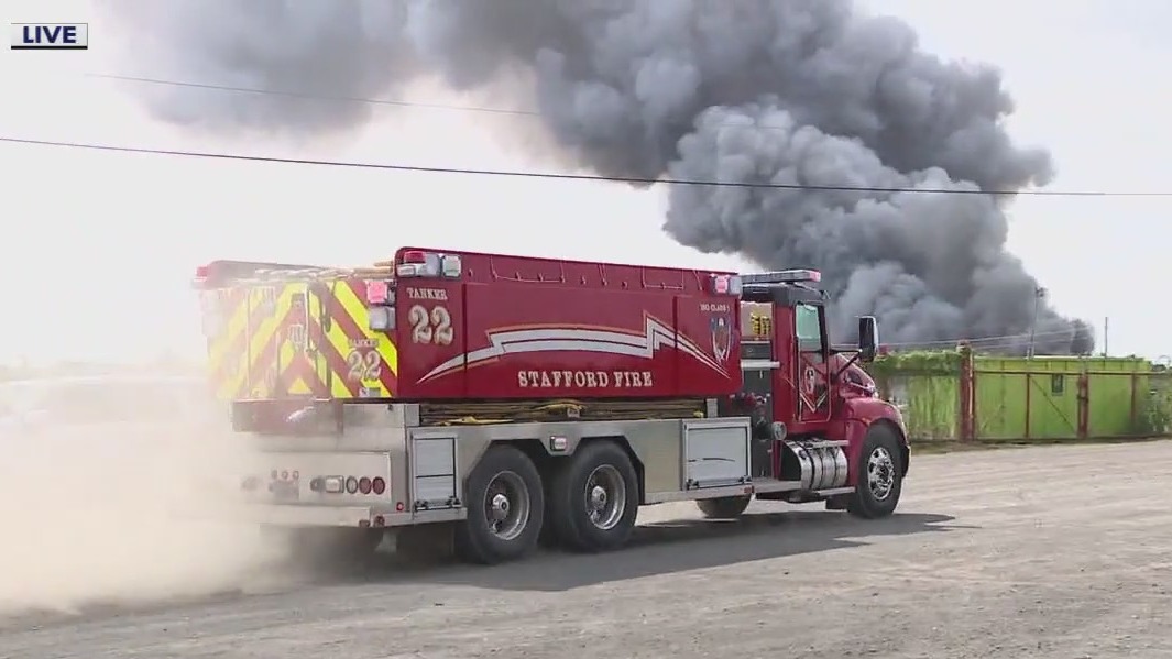Trash fire burns at recycling plant in Houston