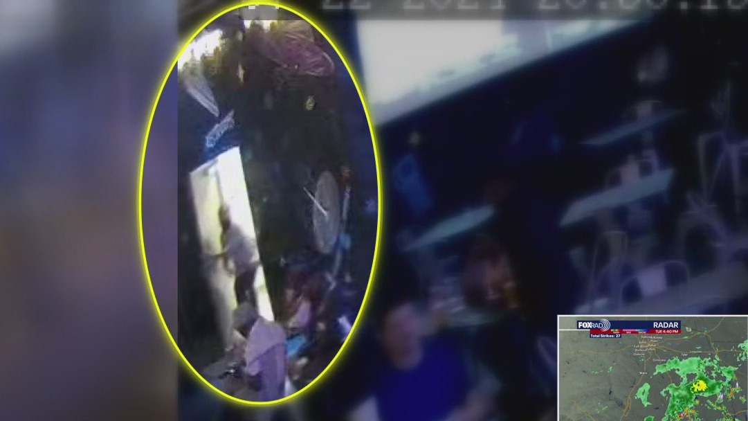 Houston woman saw phone reach under restroom stall