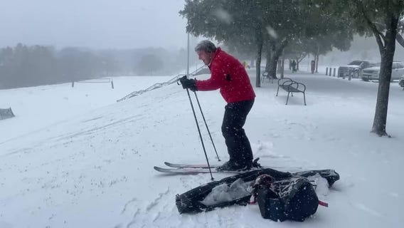 Houston snow: Man skis at Eleanor Tinsley Park during winter storm