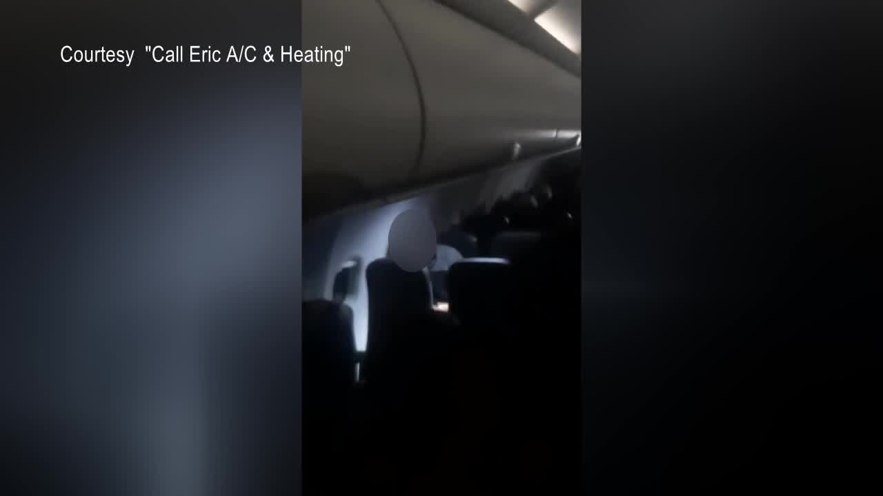 Unruly passenger on Frontier flight, passenger captures it on video