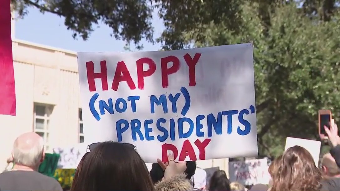 Protestors demonstrate outside of Houston City Hall