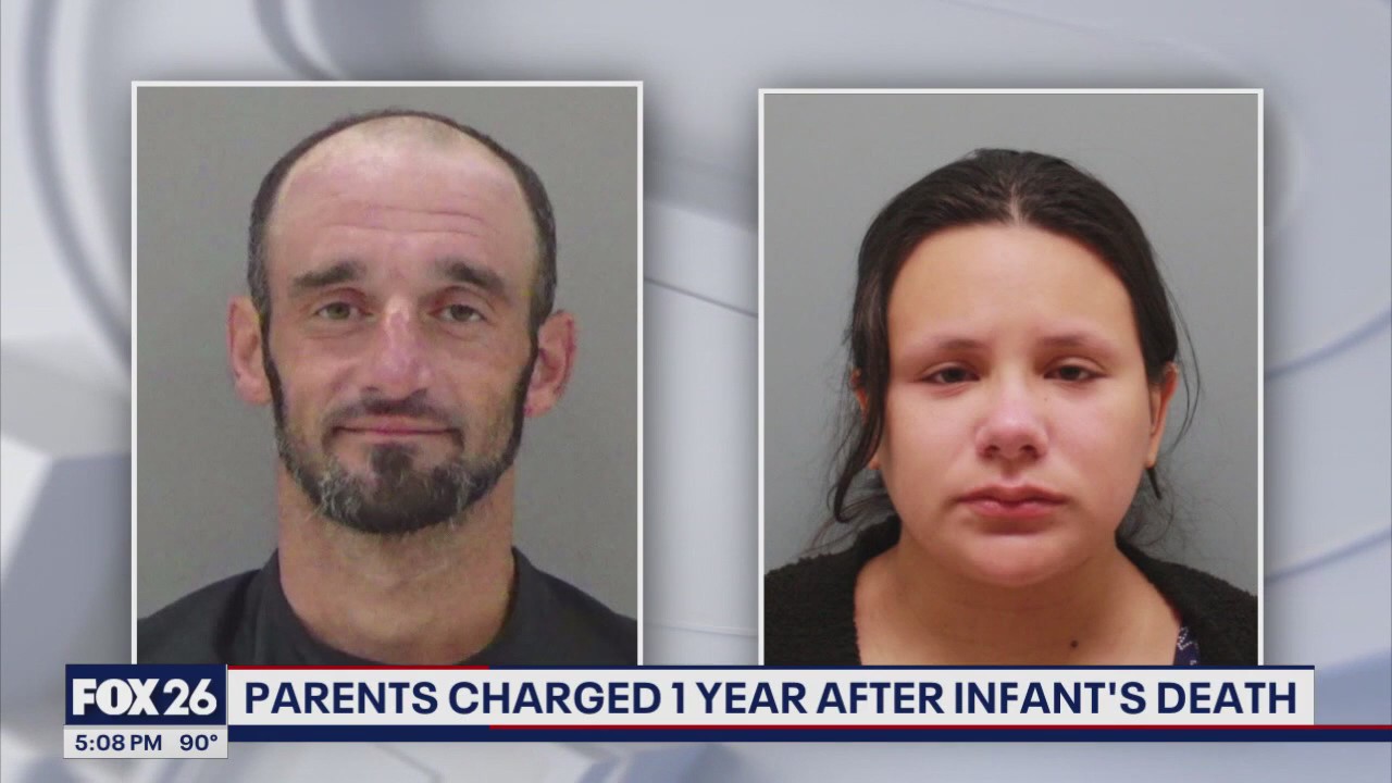 Parents charged year after infant found dead in dresser