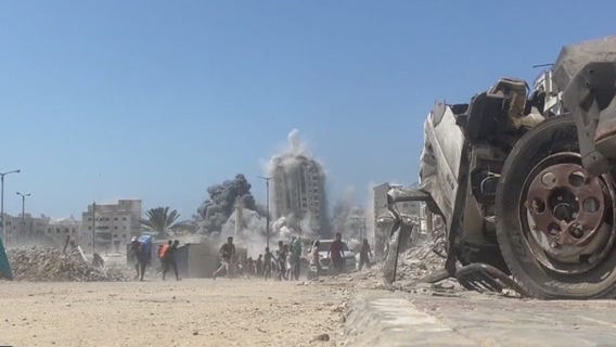 Israel strikes Gaza high-rise; Hamas shows video of hostages