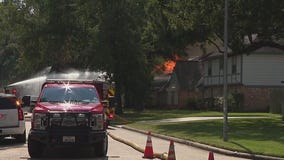 Barricaded suspect sets fire to home, body found inside