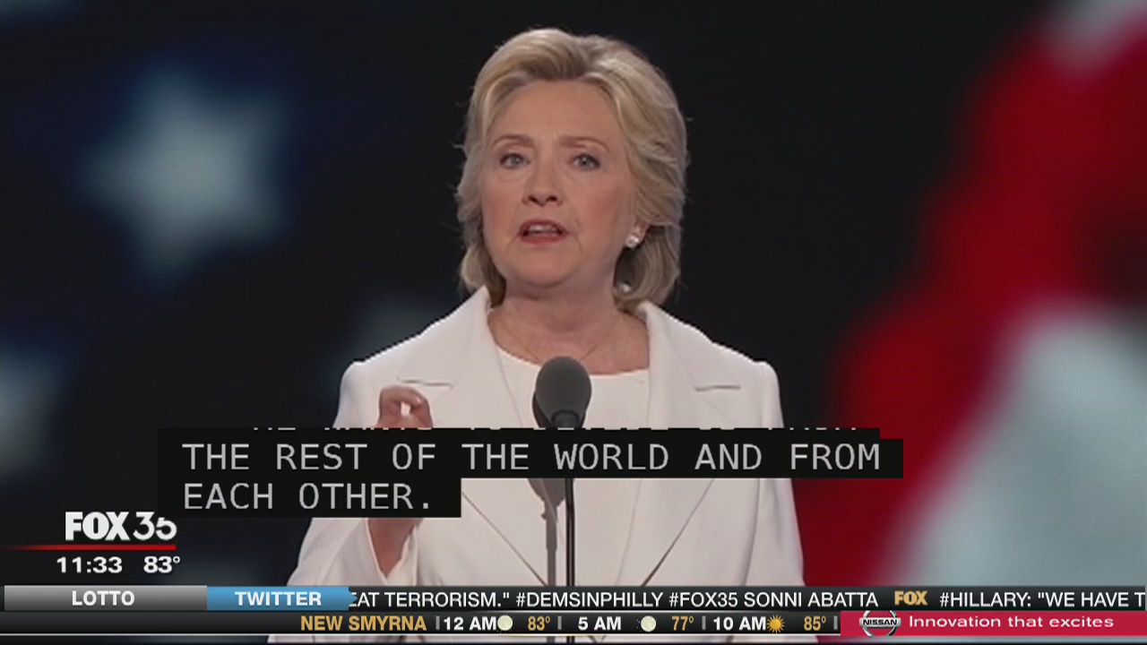 Clinton promises steady hand in dangerous world