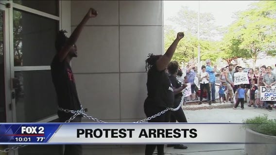 DPD arrests Black Lives Matter protesters for chaining selves to front door of 3rd Precinct