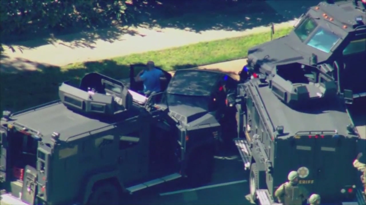 Carjacker surrenders after wild pursuit with PIT maneuvers, armed standoff