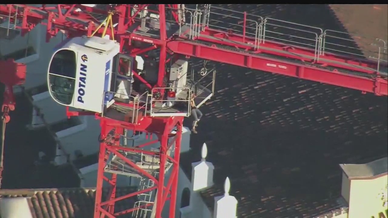 Woman climbs crane in Downtown LA
