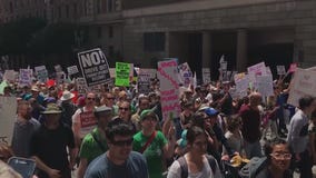 Thousands march in Downtown LA to pressure Trump to release tax returns