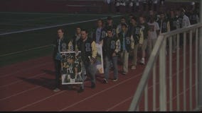 Former Irvine football player honored at candlelight vigil