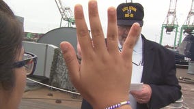 Dozens of local children become U.S. citizens aboard USS Iowa