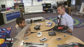 Derek Kevra introduces 'old technology' to 1st graders