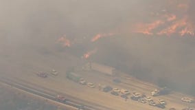 Brush fire in Sun Valley closes 210 freeway with flames and high winds