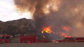 Brush fire in Sun Valley closes 210 freeway with flames and high winds