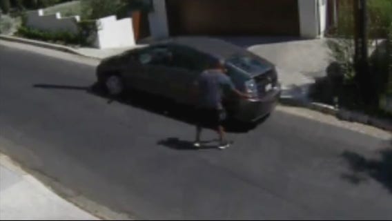 VIDEO: Man with hatchet attacks cars in Hollywood neighborhood