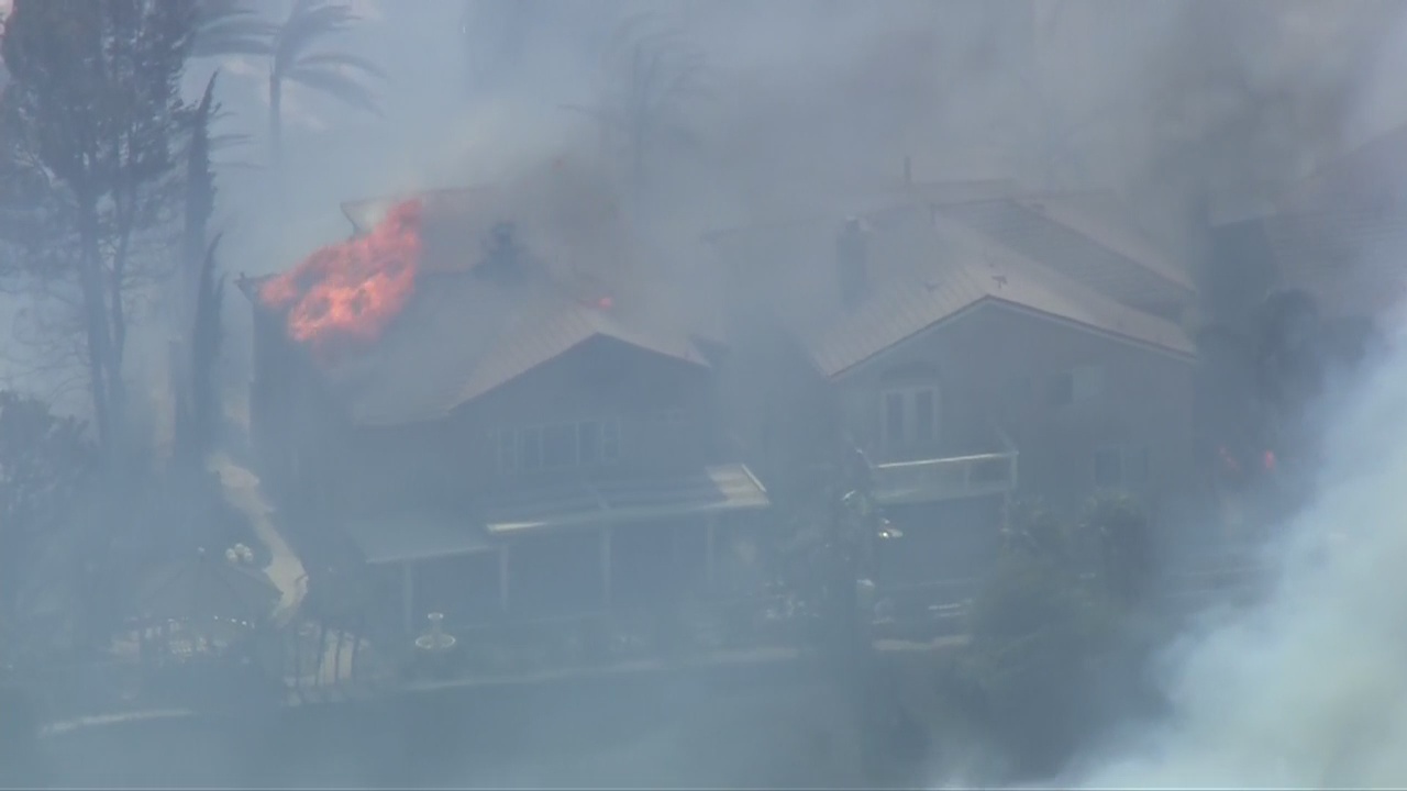 Homes burn on Canyon Heights Drive in Anaheim Hills