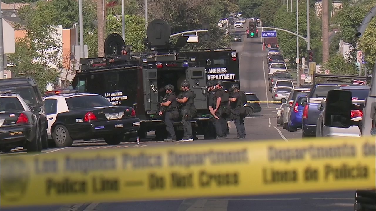 LAPD SWAT responds to armed man barricaded in South LA home