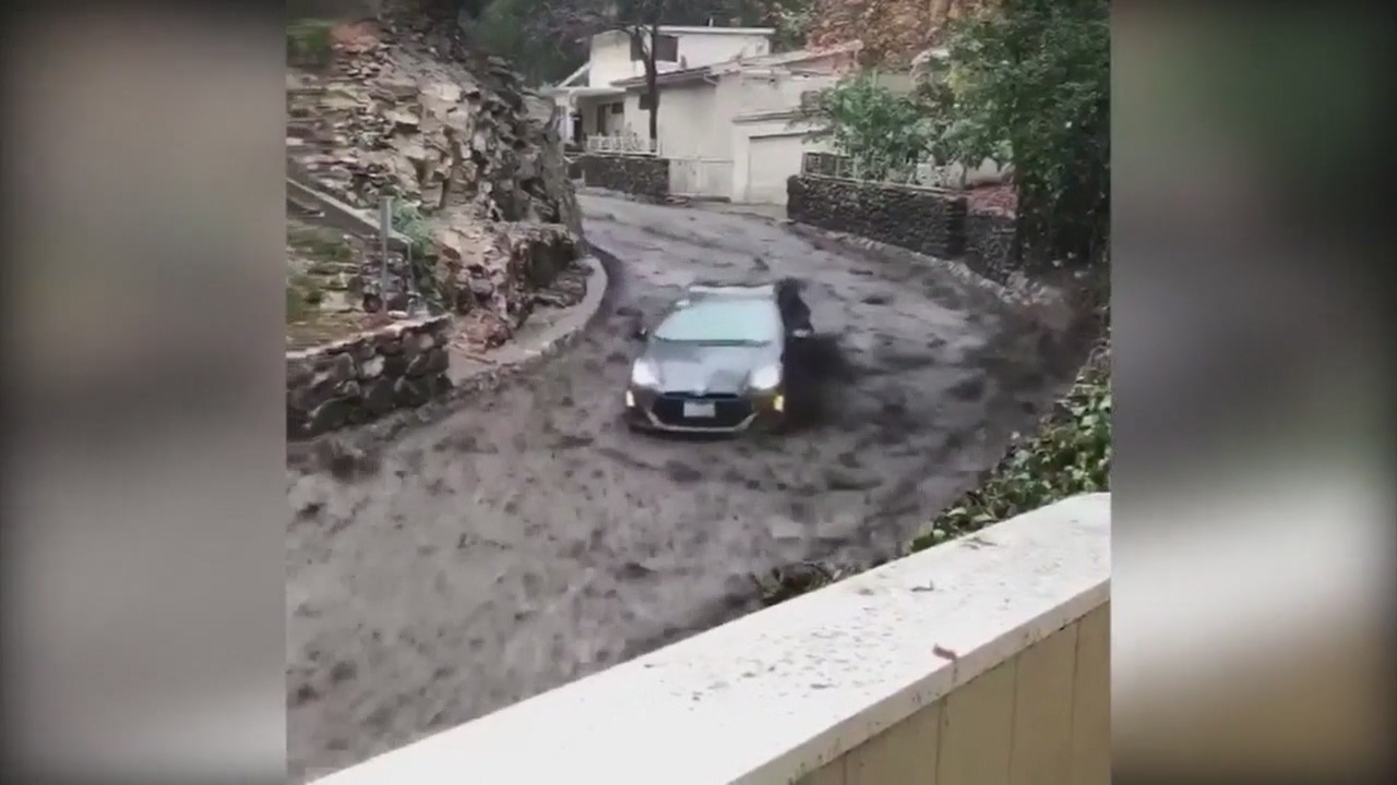 Dramatic video of Prius driver cauught in mud-flow