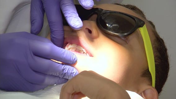 Mobile dental care unit providing free treatment for kids in LA