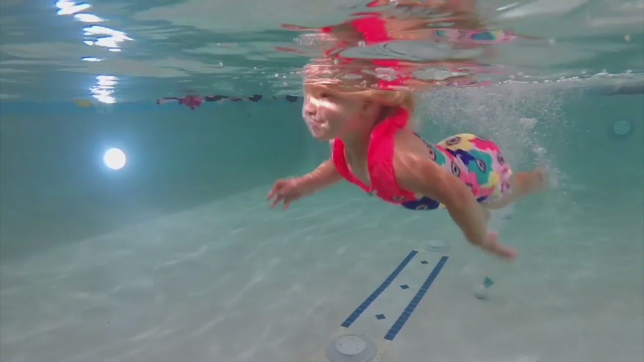 Children receive swim lessons to prevent summer tragedies