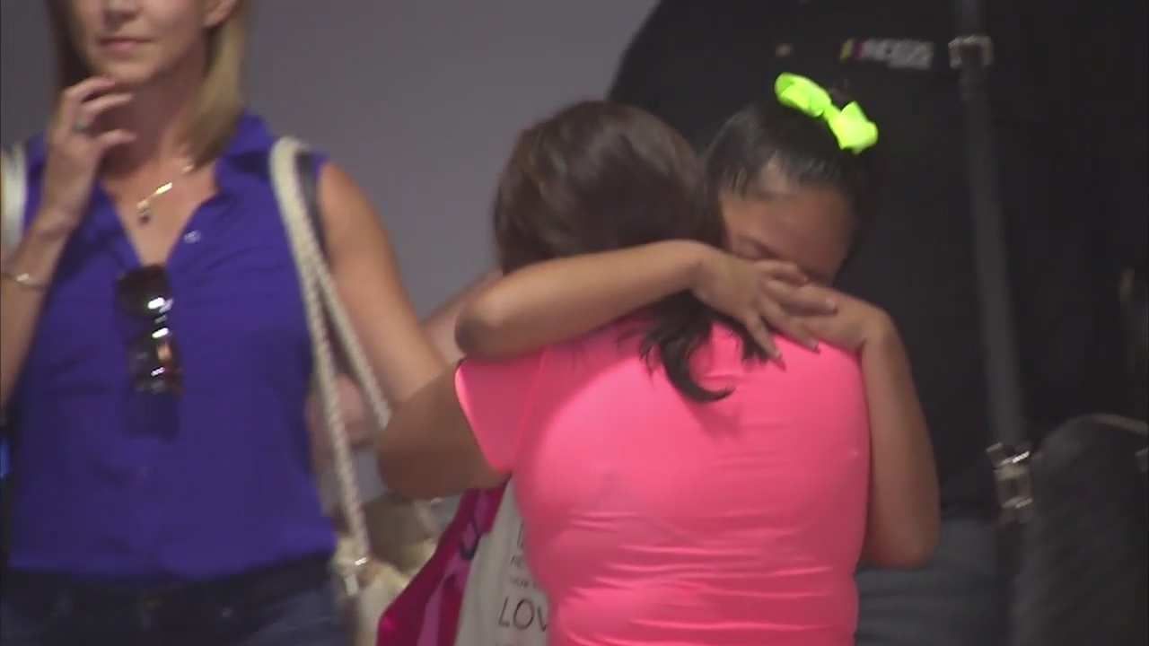 Separated migrant child reunited with parents at LAX