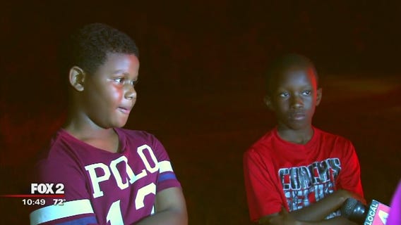 Boys knock on doors to help save families in Romulus apartment fire