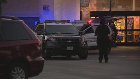 Domestic violence suspect shot by police in Ralph's lot
