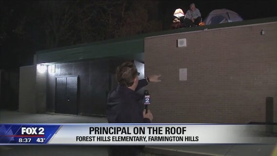 Principal spends night on roof after losing bet to students