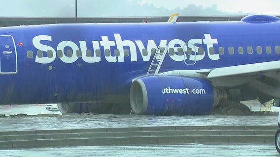 Southwest airplane slides off runway during heavy rain in Burbank