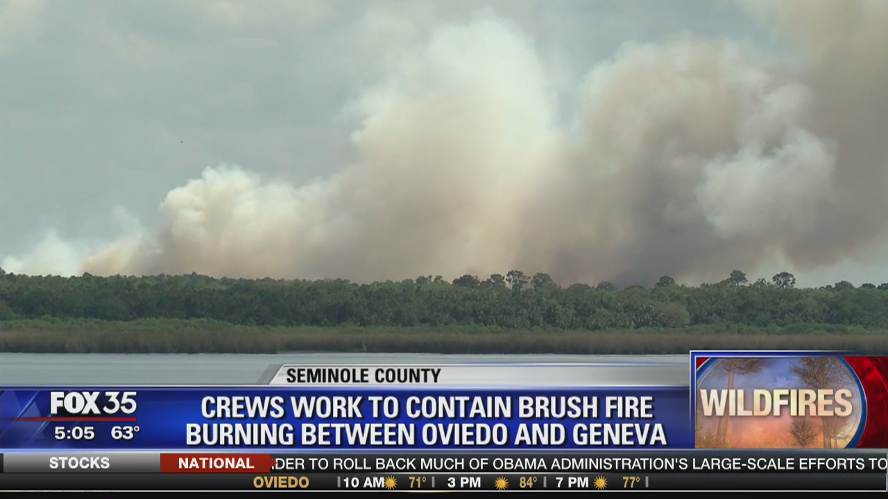 Crews work to contain brush fire burning between Oviedo and Geneva