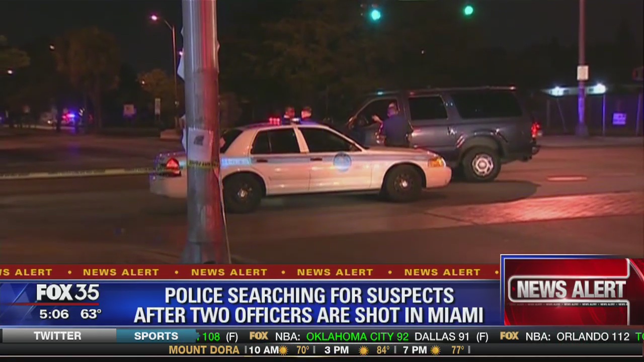 Police searching for suspects after two officers are shot in Miami ...