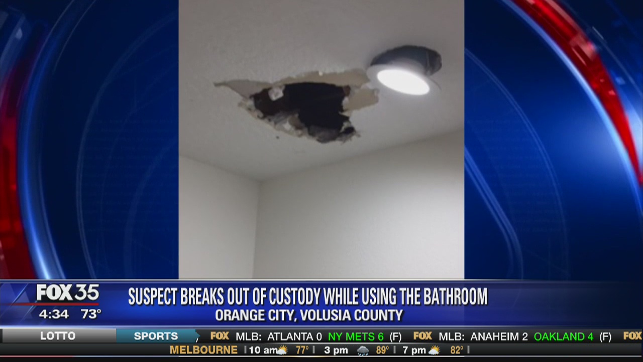 Suspect breaks out of custody while using the bathroom