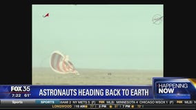 Astronauts land on earth