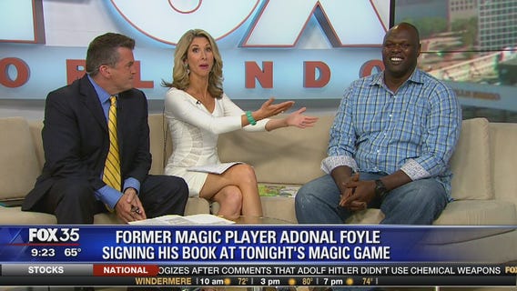 Former Magic Player Adonal Foyle signing his book at tonight's Magic game