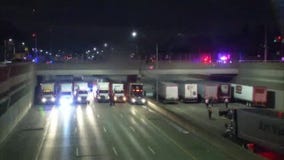 Last truck pulls up to I-696 police situation
