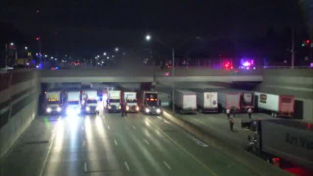 Last truck pulls up to I-696 police situation
