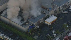 Crews battling large fire at Orange County strip mall