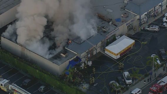 Crews battling large fire at Orange County strip mall