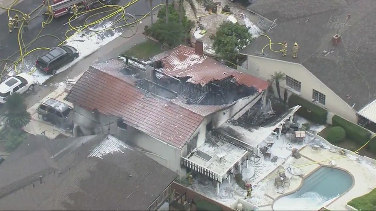 Investigation underway after plane breaks apart in OC neighborhood, killing 5 and injuring 2