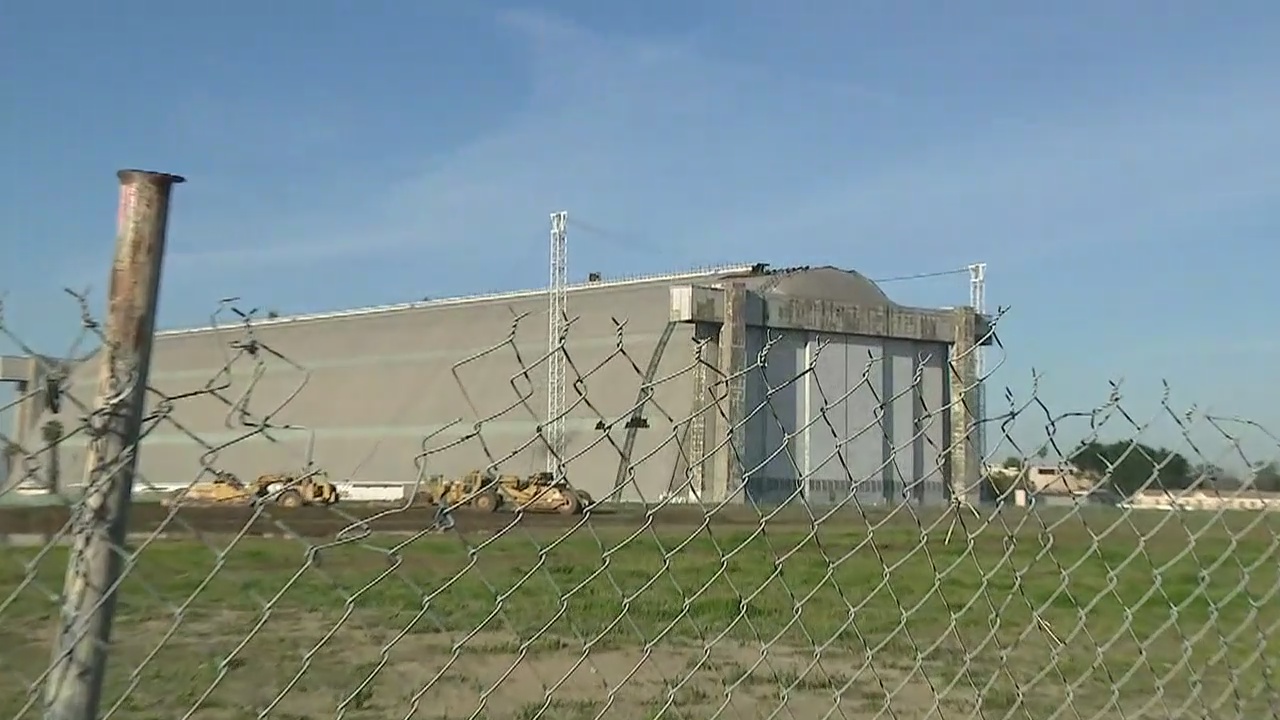 Woman rescued from roof of hangar in Tustin